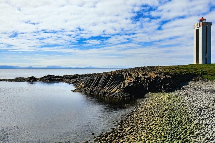 basalt columns and the lighthouse on the point at Kalfshamarsvik