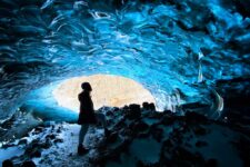 a person inside an ice cave