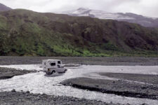 a campervan driving thorugh a ford in Thorsmork